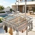 A windproof hanging laundry rack with clips—suitable for clothes, socks, and underwear; a space-saving, multifunctional drying rack for use in homes, bedrooms, and on balconies.