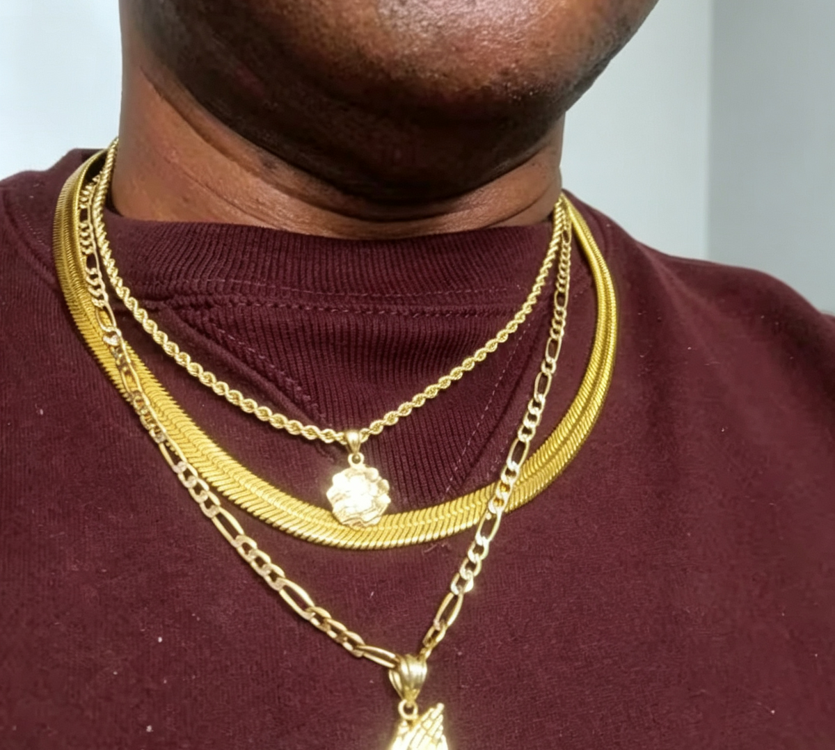 A 8mm-wide gold-plated men's chain necklace—a classic herringbone style designed to sit at the collarbone.