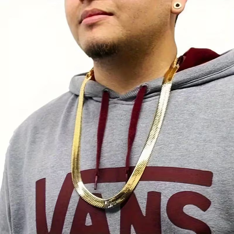 A 8mm-wide gold-plated men's chain necklace—a classic herringbone style designed to sit at the collarbone.