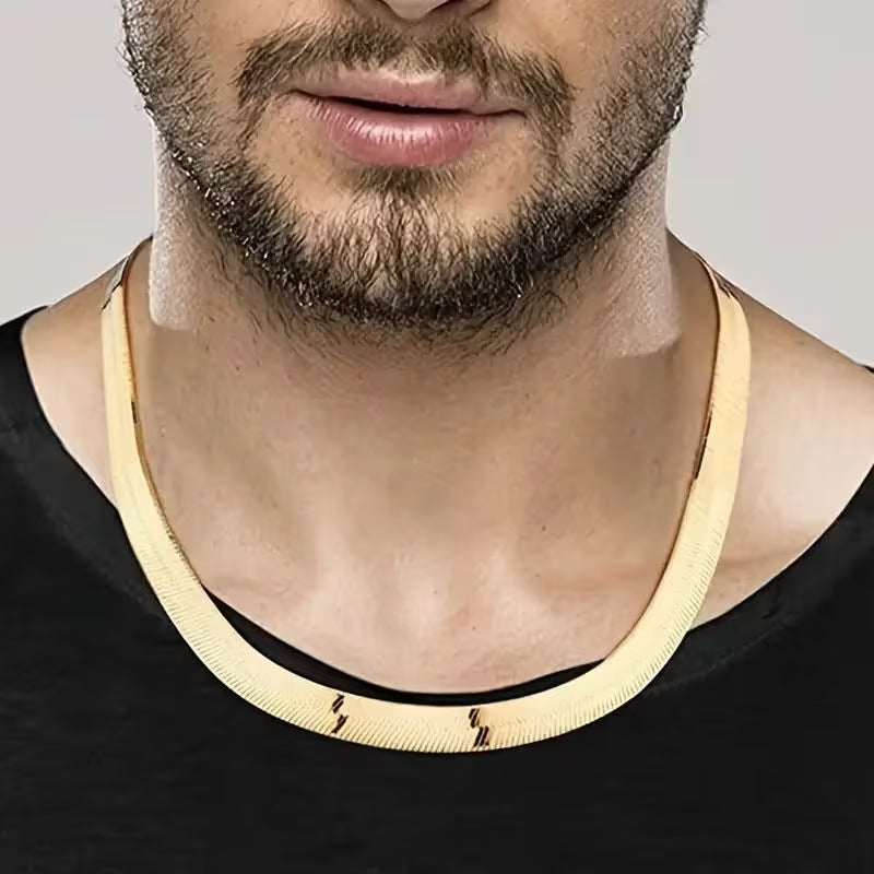 A 8mm-wide gold-plated men's chain necklace—a classic herringbone style designed to sit at the collarbone.