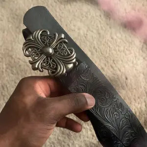 Boho-style faux leather Western-textured cowboy belt featuring a cross buckle and Gothic flair; a unisex accessory suitable for pairing with jeans and casual wear.