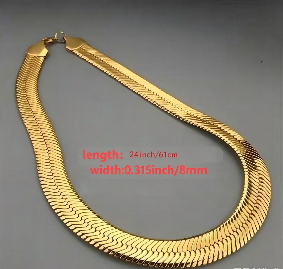 A 8mm-wide gold-plated men's chain necklace—a classic herringbone style designed to sit at the collarbone.